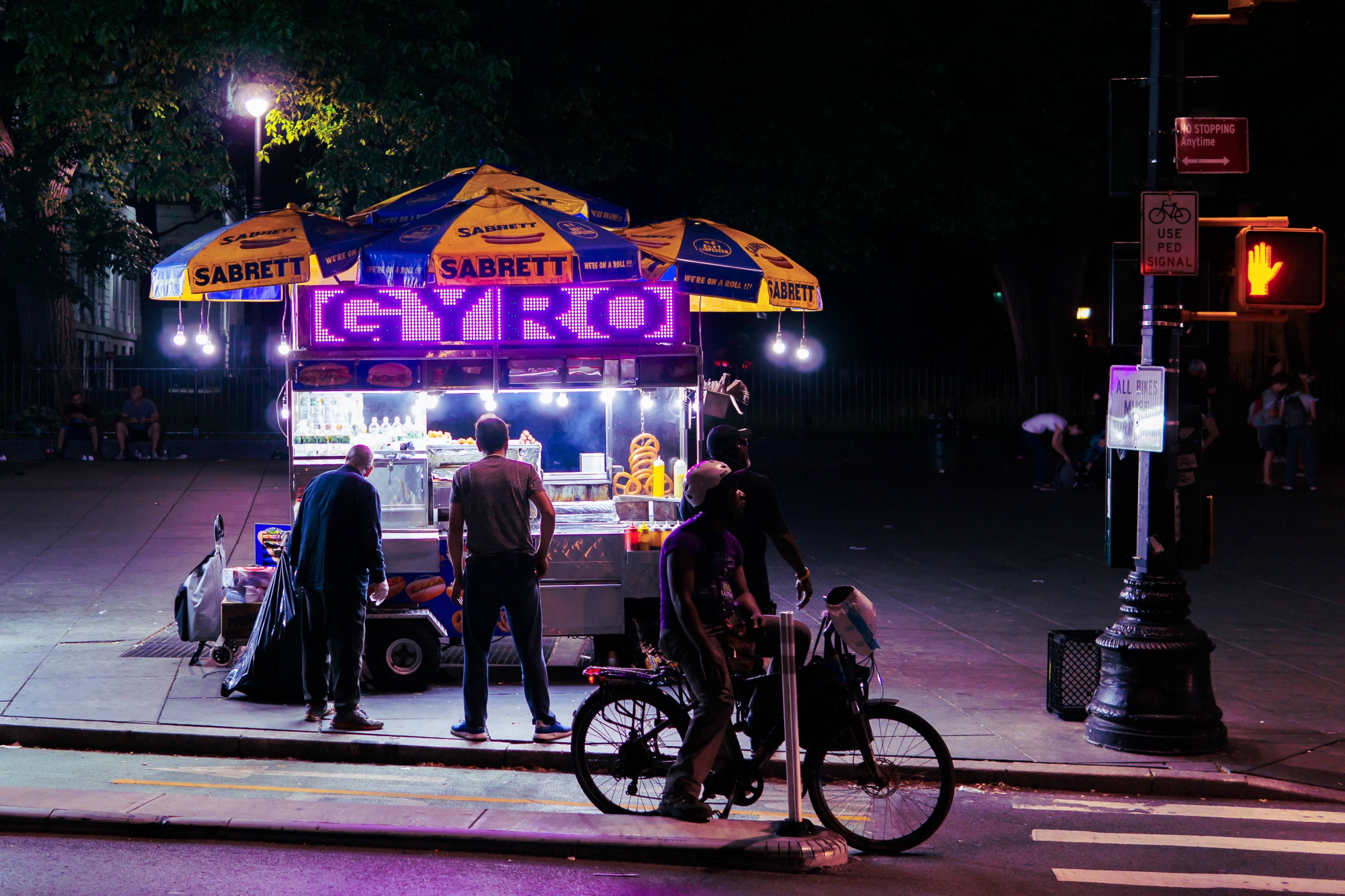 people standing near Gyro food stall during nighttime